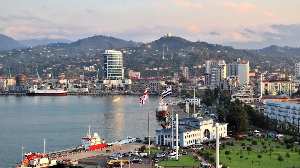 Aerial view of Batumi seafront and port with Adjara mountains in the background, Georgia