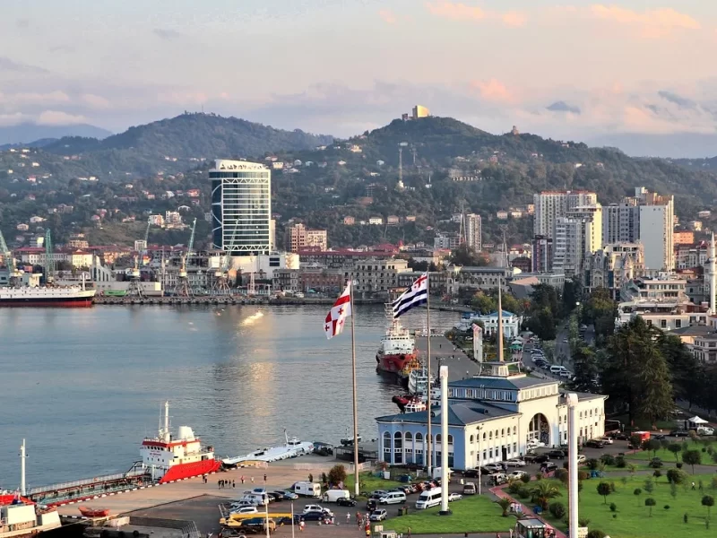 Aerial view of Batumi seafront and port with Adjara mountains in the background, Georgia